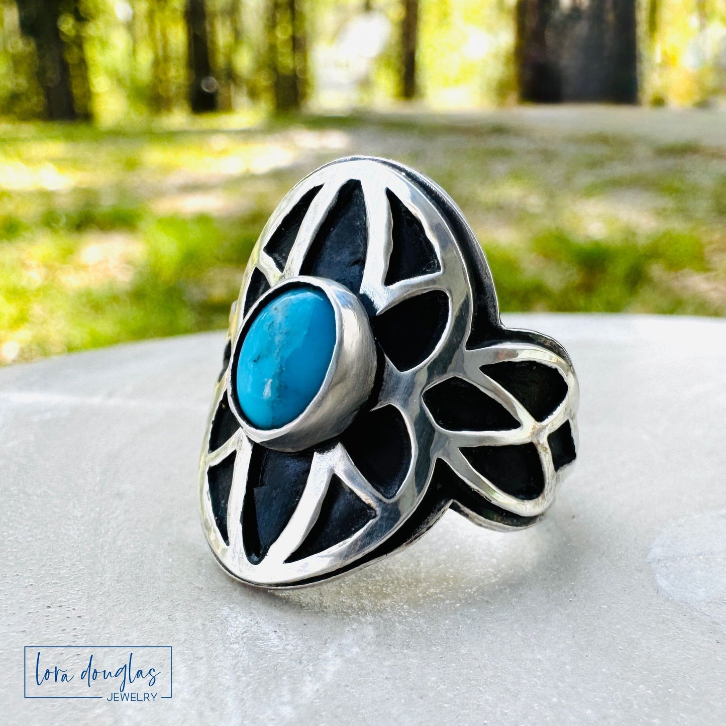 Close up of stabilized turquoise stone in silver ring