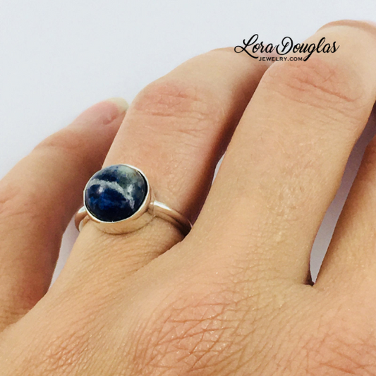 Sodalite and sterling silver ring featuring a natural 10mm blue gemstone, with the richly colored stone as the focal point of this finished size 6 ring for lovers of blue stones and natural gemstone jewelry.