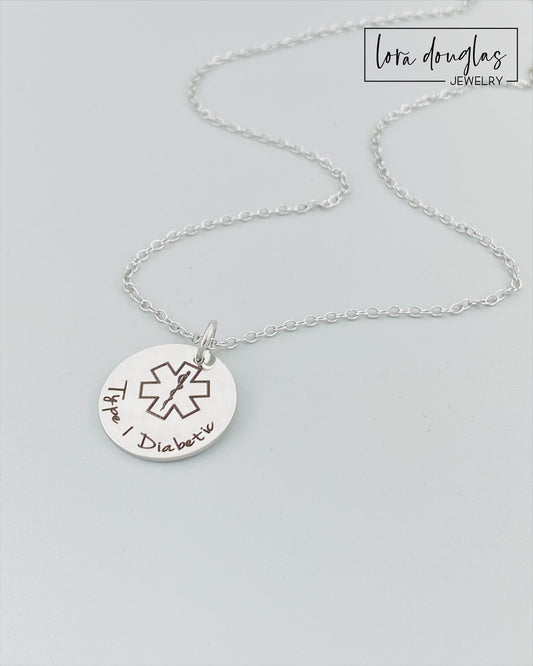 custom engraved medical ID pendant necklace shown in silver stainless steel with engraved medical alert symbol and personalized health information, durable hypoallergenic medical alert necklace with minimalist style