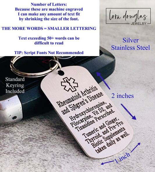 A stainless steel medical alert keychain displayed on a key. The tag has sample text for customization and indicates that additional text can be added on the back.