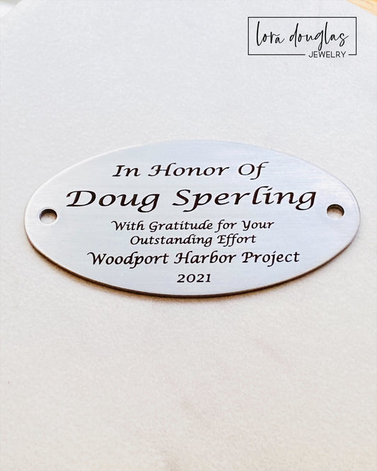 This engraved memorial plaque offers a timeless way to honor loved ones or commemorate special moments. Crafted for clarity and durability, it serves as a meaningful dedication on benches or other surfaces. Please note that hardware for mounting is not included, allowing you to select the best option for your installation needs. Ideal for personalized tributes, this plaque combines craftsmanship with lasting remembrance.