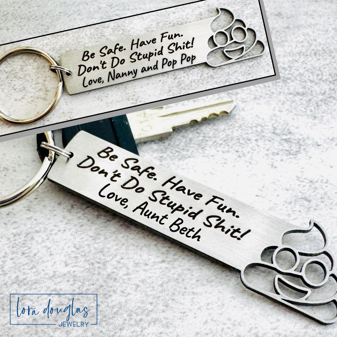 Metal keychain with engraved text and design on a light gray background
Don't Do Stupid Shit Poop Emoji Cutout Keychain, Personalized Funny Stainless Steel Keyring, Customize With Your Name, Gift Bag Included