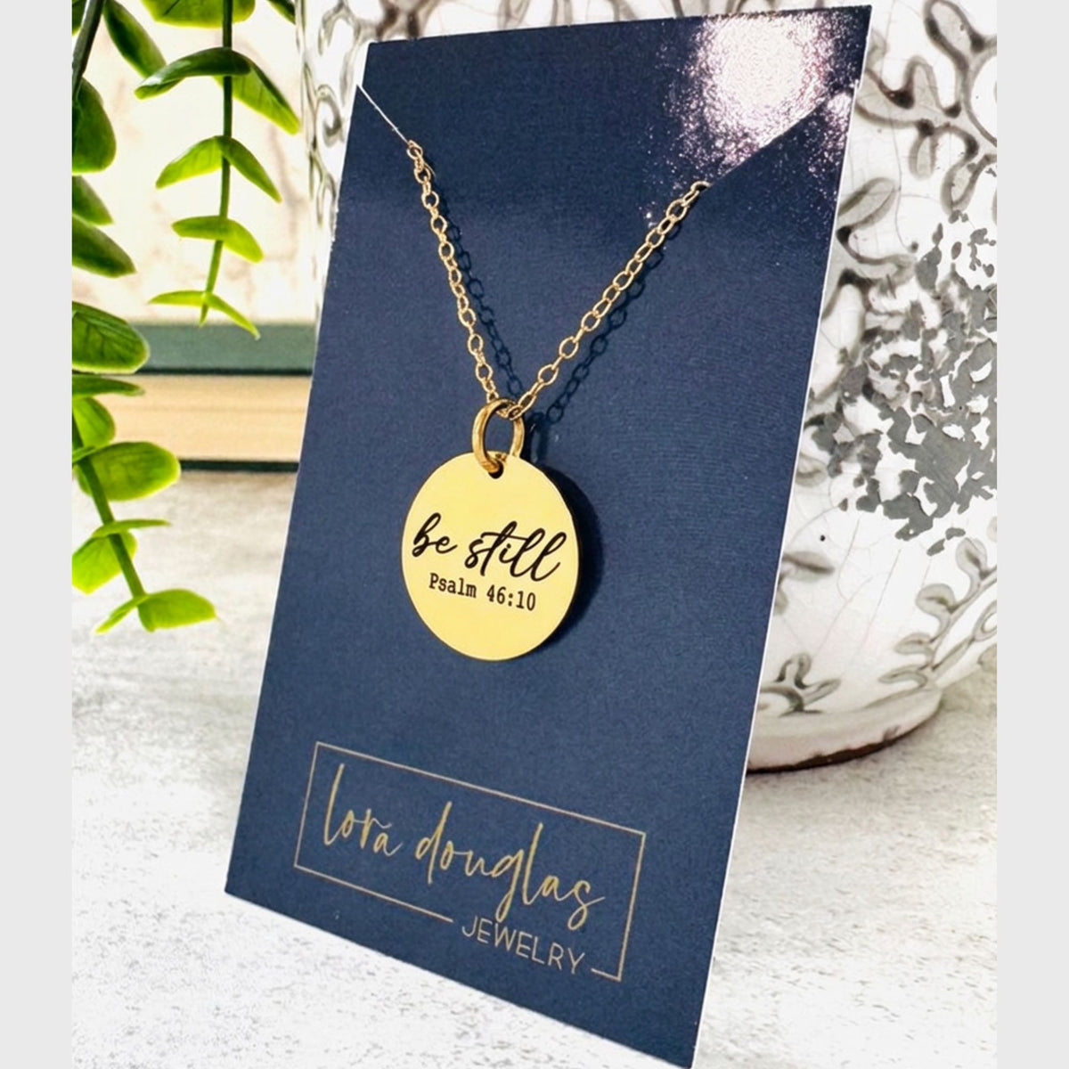 Be Still Bible verse necklace inspired by Psalm 46, featuring a permanently engraved round pendant and a simple faith based design for women, teens, Bible study friends, confirmation gifts, and Christian gifts.