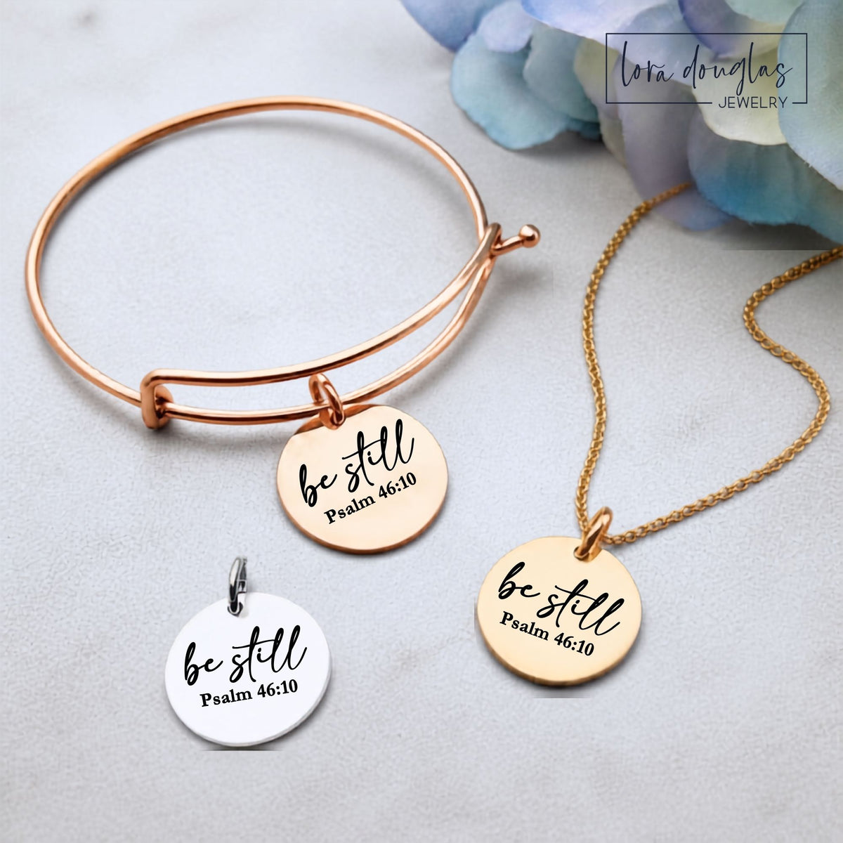 Be Still Psalm 46 engraved disc pendant featuring a meaningful Christian Bible verse design, available in silver, gold, rose gold, stainless steel, and sterling silver with necklace, bracelet, and charm options.