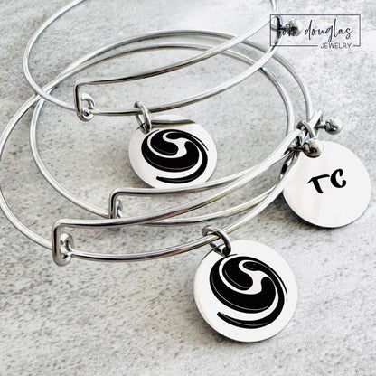Custom art pendant displaying original artwork permanently laser engraved in black on a round stainless steel charm, with multiple pendant sizes and silver, gold, or rose gold finishes available for personalized jewelry