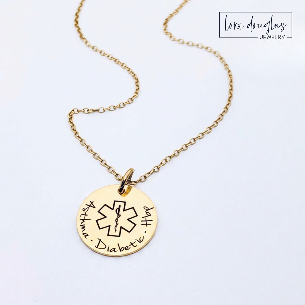 Custom engraved medical alert jewelry featuring a round stainless steel charm in silver, gold or rose gold with personalized medical information on the front and back for important health and emergency identification.
