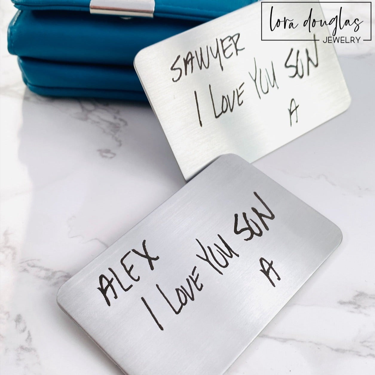 Custom handwriting wallet card featuring a handwritten message permanently laser engraved on matte silver stainless steel. Credit card size memorial keepsake designed to carry in a wallet or display inside a shadow box.