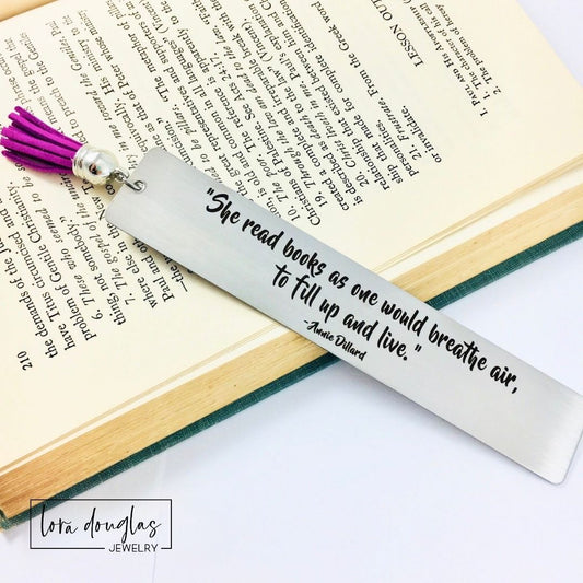Elegant engraved bookmark featuring the quote "She read books as one would breathe air to fill up and live" on brushed stainless steel. Personalized reader gift for book lovers, librarians, BookTok fans, authors, and literature enthusiasts.