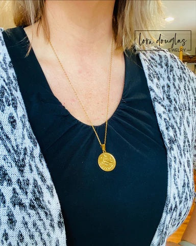 Gold Constellation Necklace showcasing an engraved zodiac sign pendant crafted from stainless steel. Astrology inspired necklace with star pattern on a durable 24 inch chain for everyday wear.