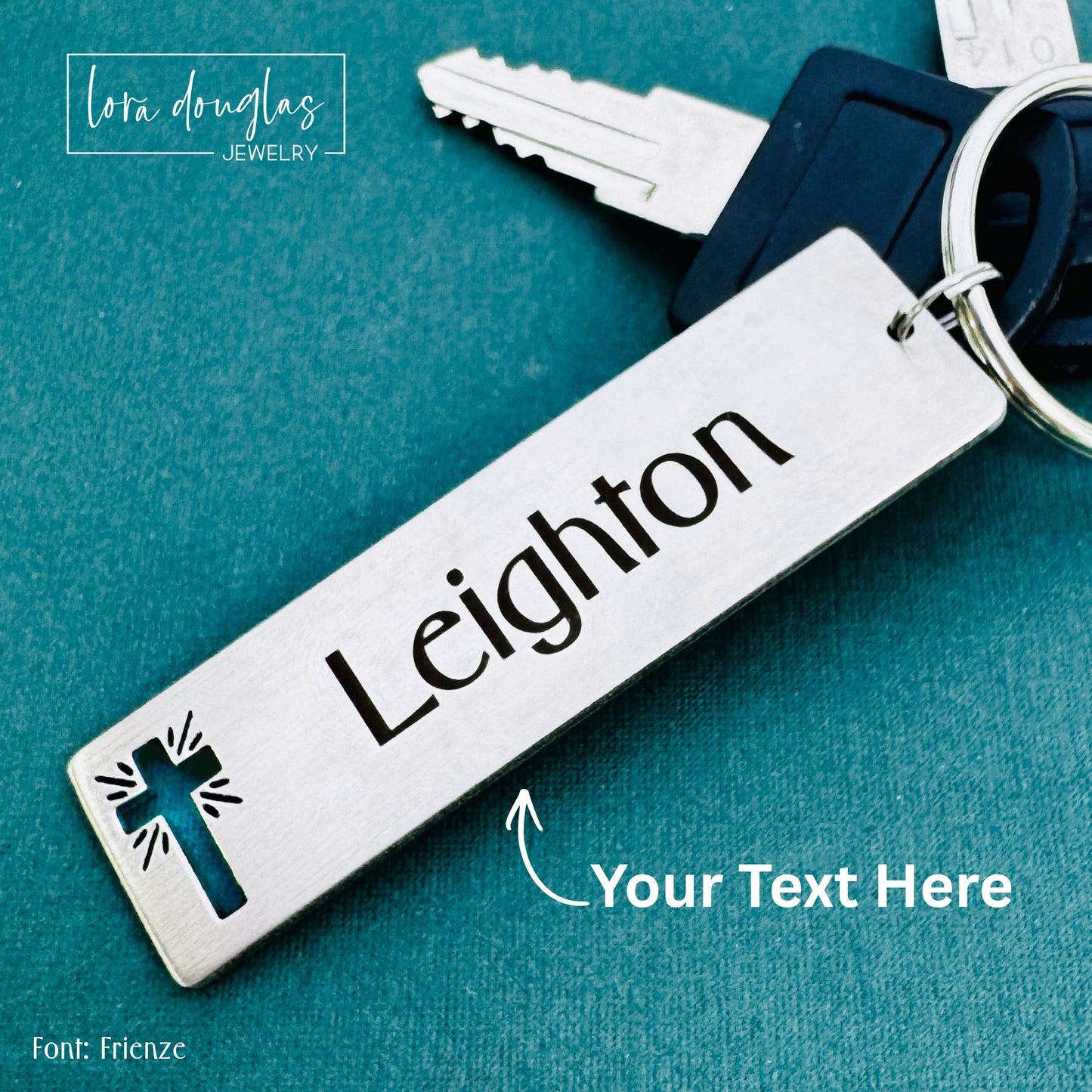 Laser engraved stainless steel keychain featuring custom name and cross cutout accent designed as Bible verse gift or encouragement gift.