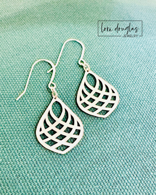 Modern sterling silver drop earrings featuring an elongated teardrop silhouette with a clean open design, measuring approximately 1.5 inches long and 0.75 inches wide for lightweight everyday style.
