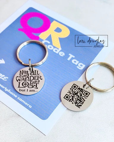 Two keychains on a Lota Douglas Jewelry card with QR code and motivational quote.