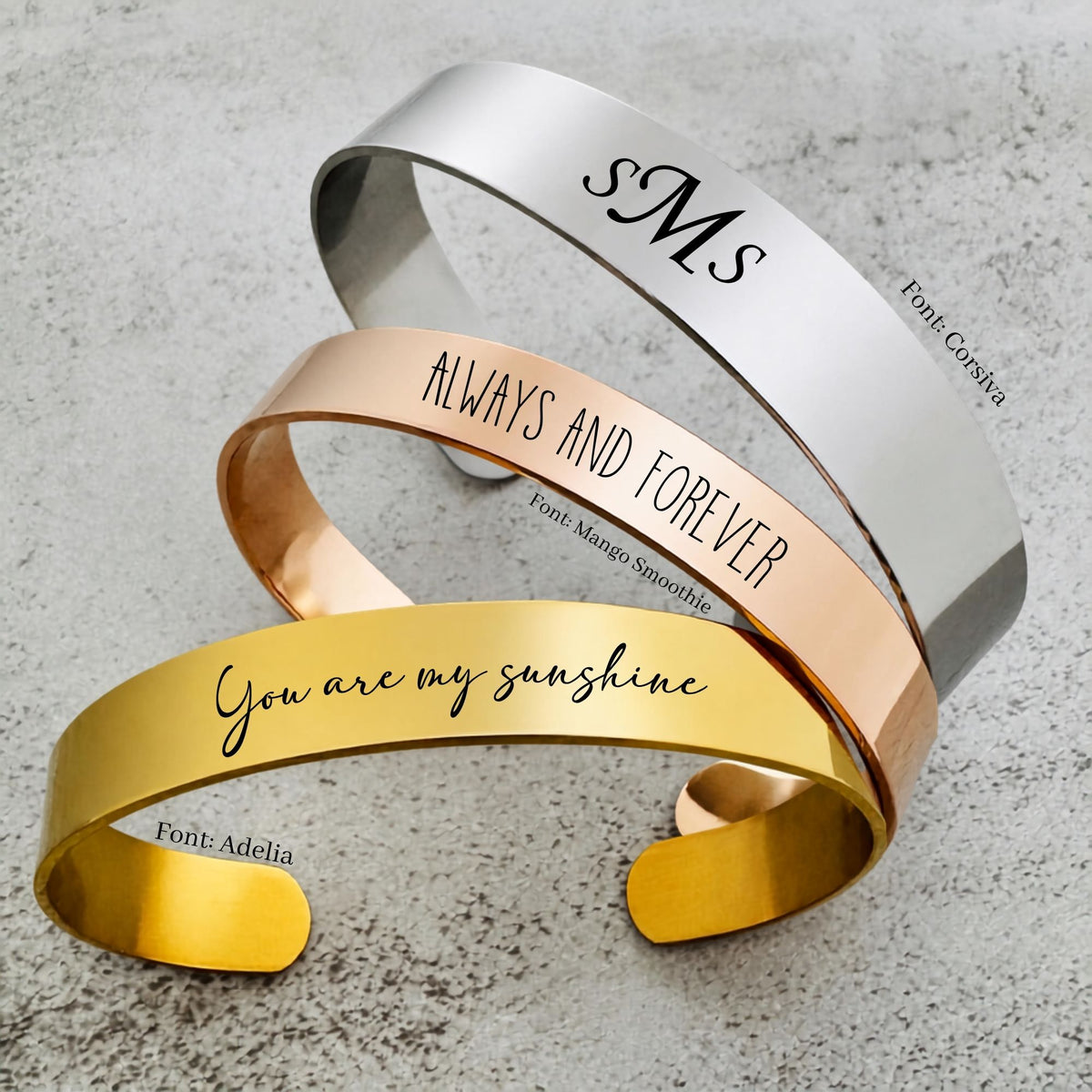 Personalized stainless steel cuff bracelet with custom laser engraved text, available in silver, gold, and rose gold with multiple bracelet widths, sizes, and font choices for meaningful custom jewelry.