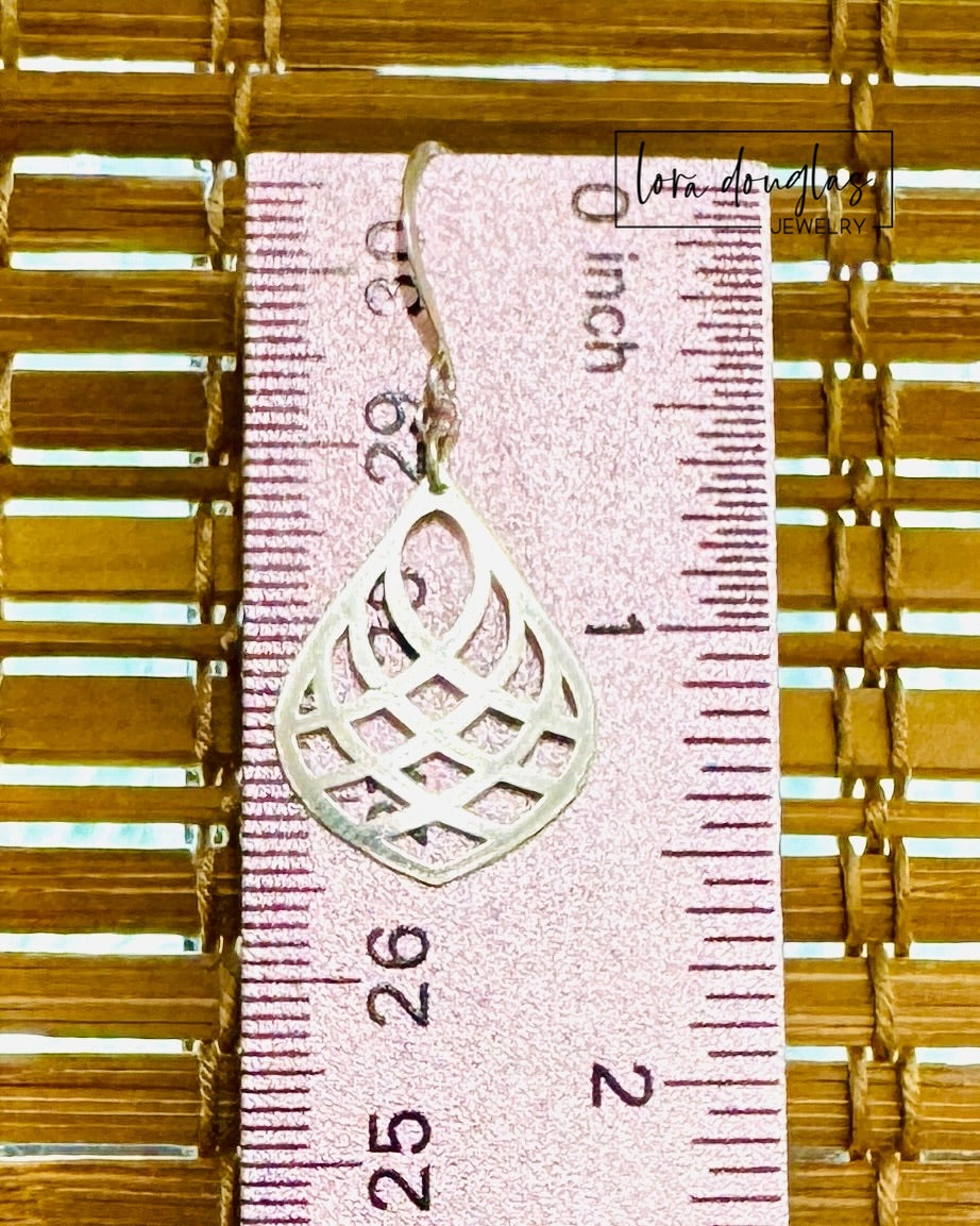 Sterling silver minimalist earrings featuring a sleek teardrop shape with an open center, designed as lightweight modern drop earrings for shoppers who prefer simple jewelry with distinctive geometric lines.

