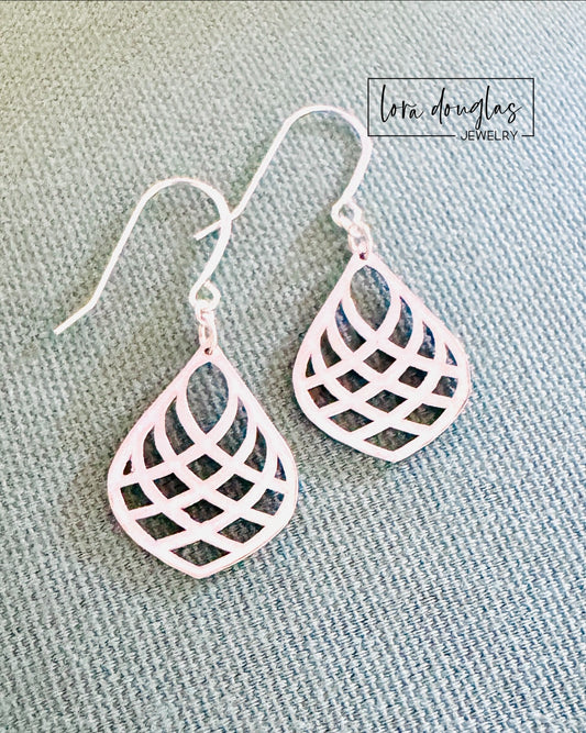 Sterling silver teardrop earrings featuring a sleek open geometric shape, designed as lightweight 1.5 inch drop earrings for shoppers looking for modern minimalist silver jewelry for everyday wear.
