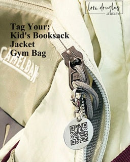 Close-up of a beige backpack with a visible brand logo and a QR code charm.