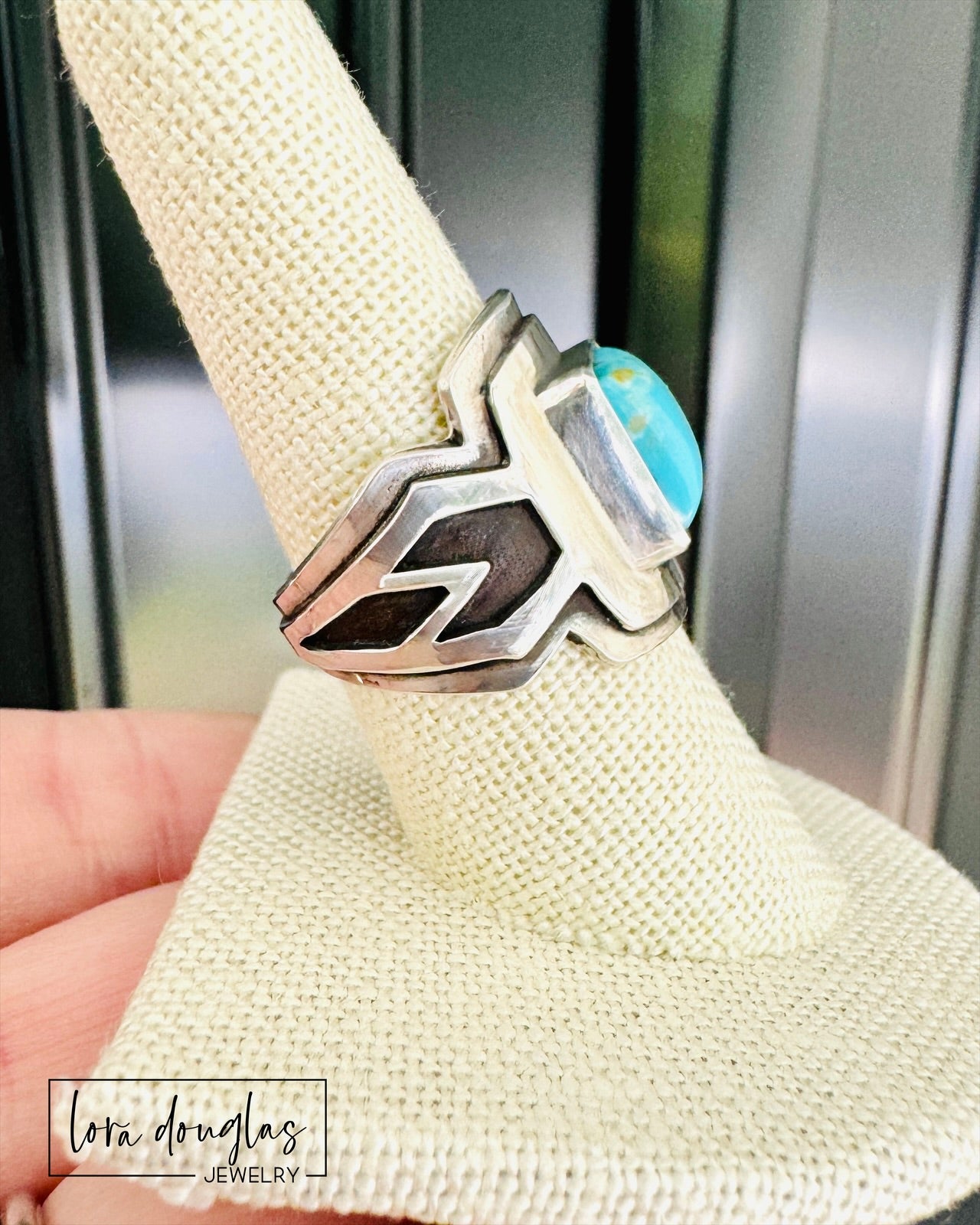 close up of handmade Kingsman Turquoise ring displaying vivid blue square cabochon stone and layered sterling silver saddle ring construction, artisan turquoise jewelry handcrafted from solid .925 silver