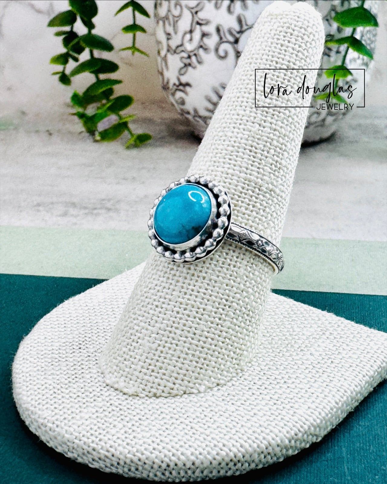 close up view of handcrafted Kingsman Turquoise ring in solid sterling silver, showcasing natural blue stabilized turquoise gemstone with classic round shape and handmade artisan craftsmanship in size 8.75