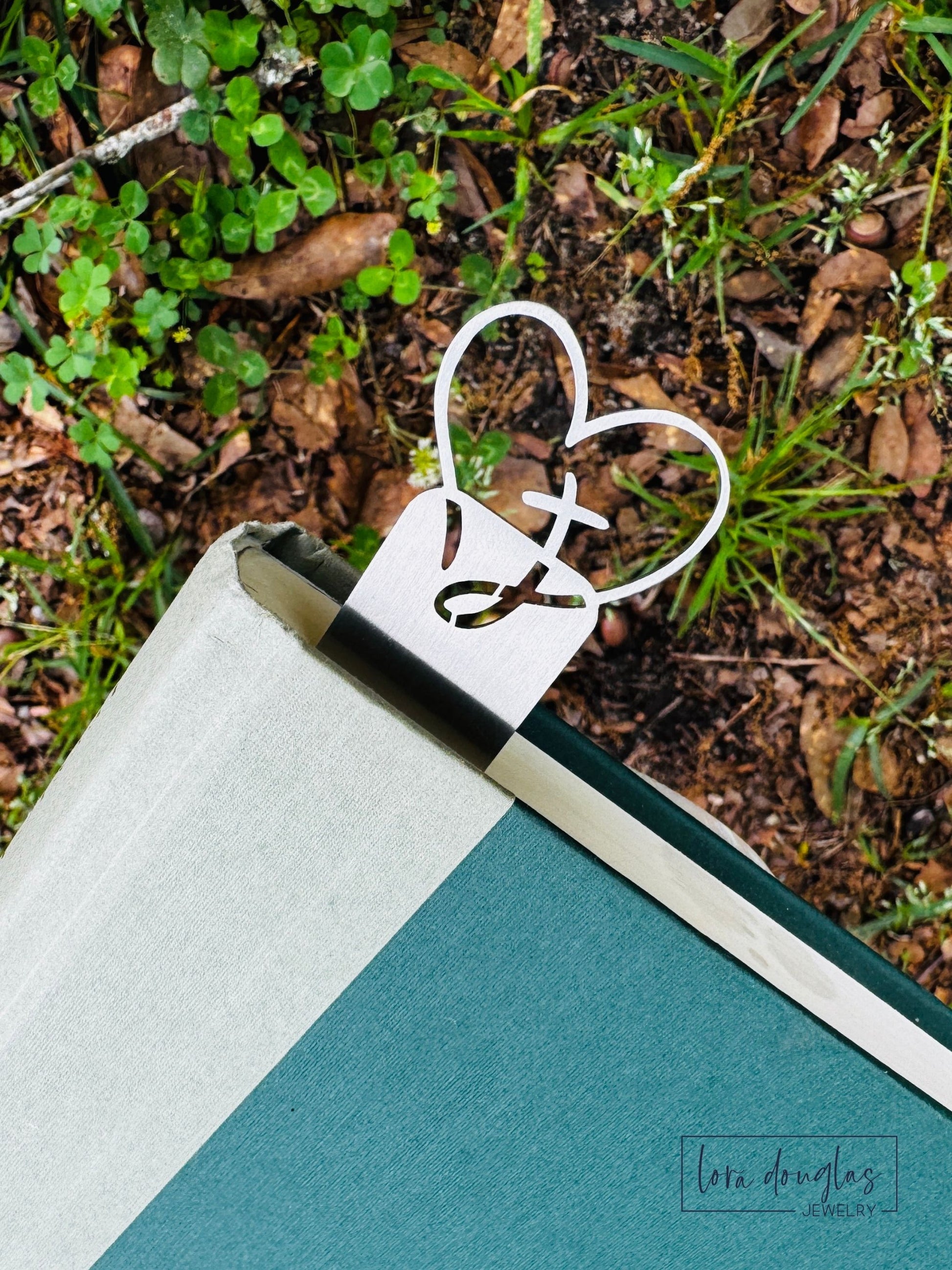 custom text bookmark in book showing slim metal design