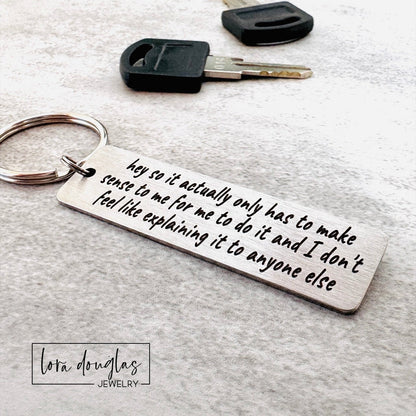  stainless steel keychain features the iconic "365 buttons" TikTok quote laser-engraved in full: "hey so it actually only has to make sense to me for me to do it and I don't feel like explaining it to anyone else." A must-have for independent spirits who live by their own rules and couldn't care less about justifying themselves. 