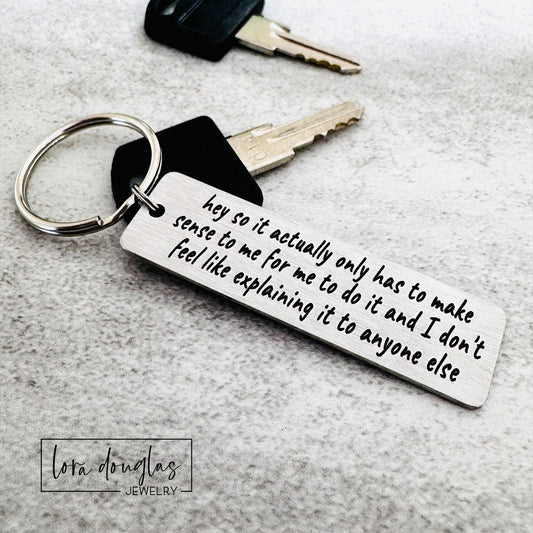  stainless steel keychain features the iconic "365 buttons" TikTok quote laser-engraved in full: "hey so it actually only has to make sense to me for me to do it and I don't feel like explaining it to anyone else." A must-have for independent spirits who live by their own rules and couldn't care less about justifying themselves. 