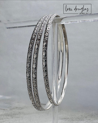 Sterling silver handcrafted bangle bracelet designed for stacking or everyday wear.