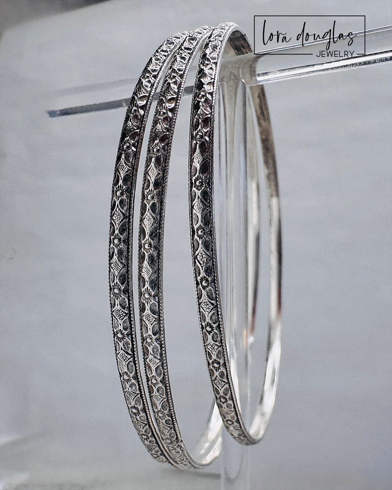 Sterling silver handcrafted bangle bracelet designed for stacking or everyday wear.