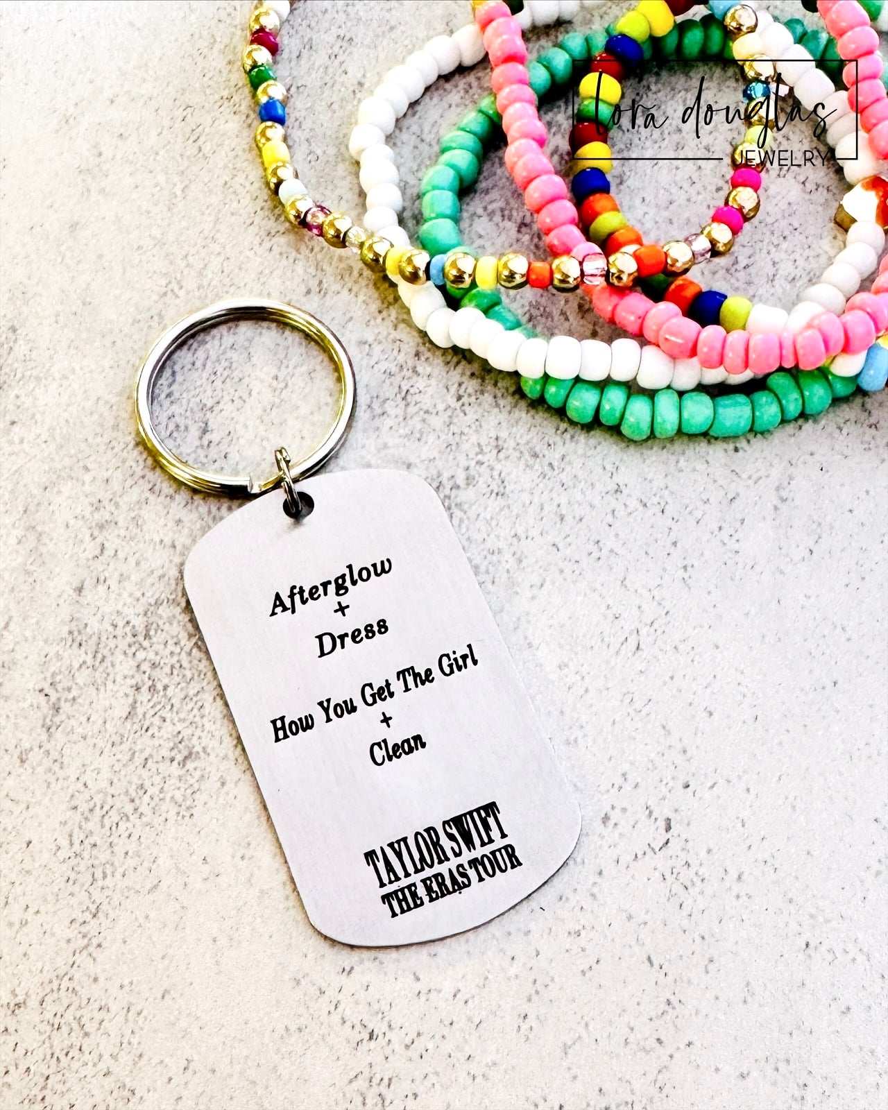 back of keychain with surprise songs mashup from eras tour