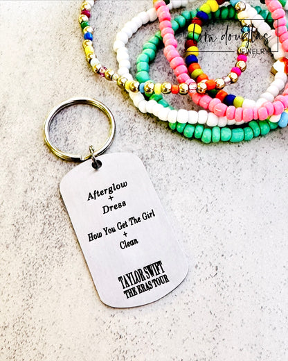 back of keychain with surprise songs mashup from eras tour