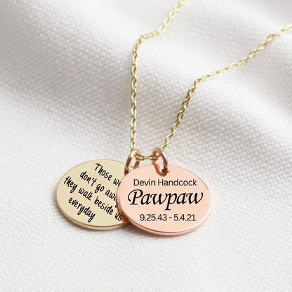 Gold and Rose Gold necklace with two engraved discs on a white background