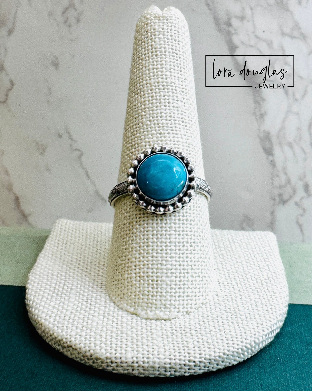genuine Kingsman Turquoise sterling silver ring handmade from solid .925 silver with a vibrant natural blue 10mm round cabochon, one of a kind artisan turquoise ring sized 8.75 displayed in close up detail