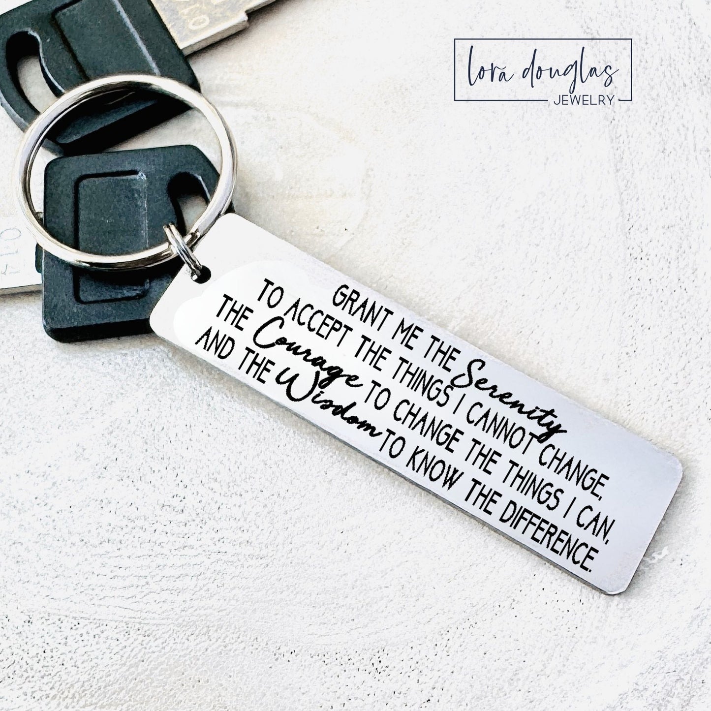 Keychain with engraved with serenity prayer on a white background