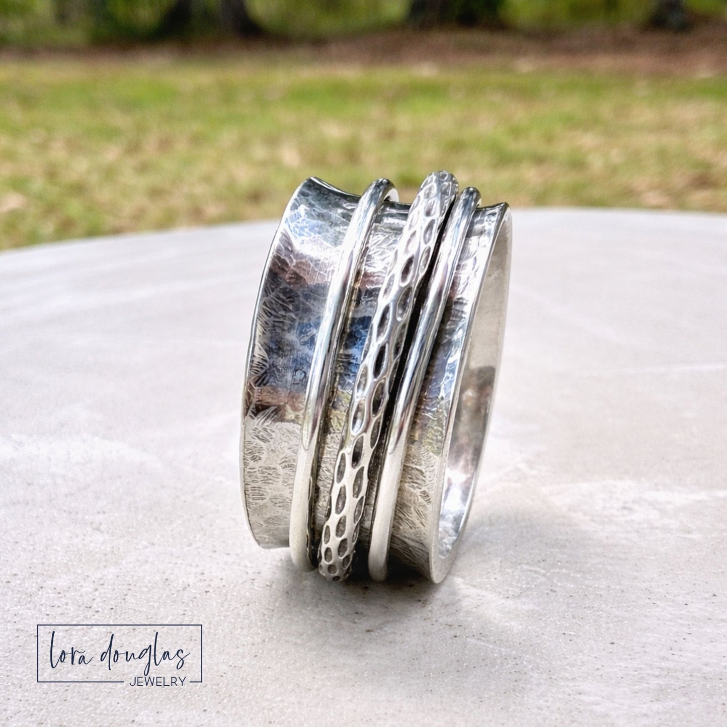 handmade silver fidget ring close up texture detail