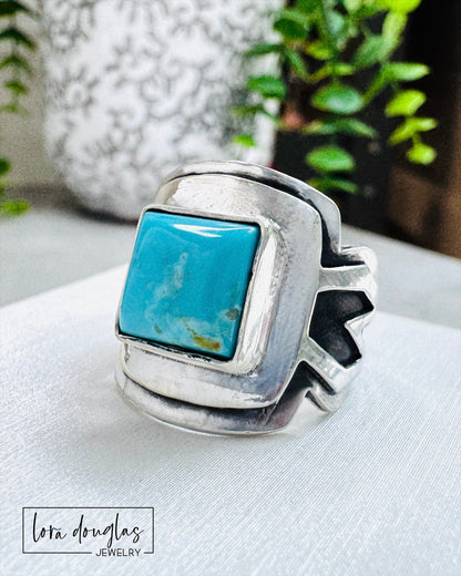 handmade sterling silver saddle ring showcasing a 10mm square Kingsman Turquoise stone with vibrant natural blue color, handcrafted artisan turquoise ring constructed from layered 19 gauge and 21 gauge silver