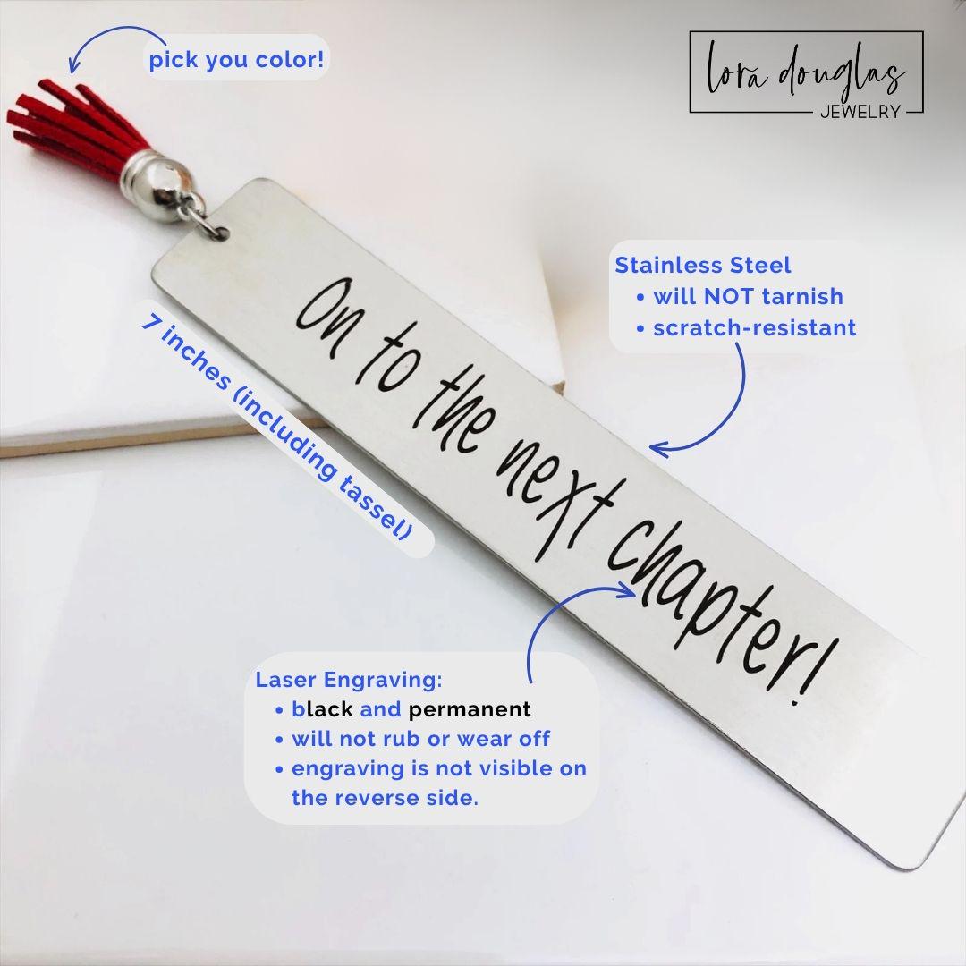 inspirational stainless steel bookmark engraved with on to the next chapter quote, personalized graduation gift with leather tassel and permanent laser engraving shown in close up detail