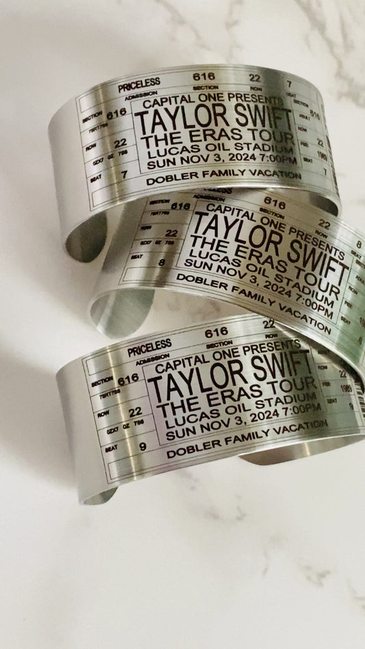 stainless steel ticket bracelets with custom laser engraving designed to look like a concert ticket. personalized with real concert ticket details.