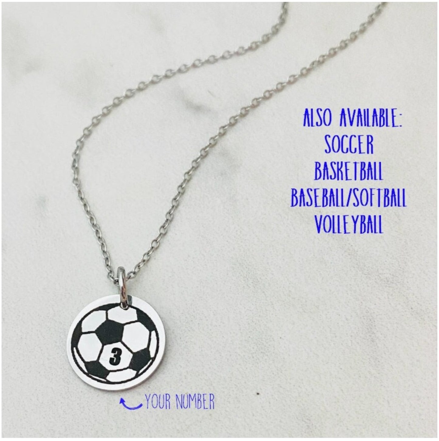 Necklace with a soccer ball pendant personalized with a jersey number on a light gray background