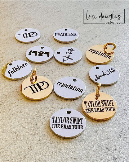 13 Charm Set Includes: Taylor Swift, Fearless, Speak Now, RED, 1989, Lover, Reputation, Folklore, Evermore, Midnights, TTPD, Eras Tour, The Life of a Showgirl