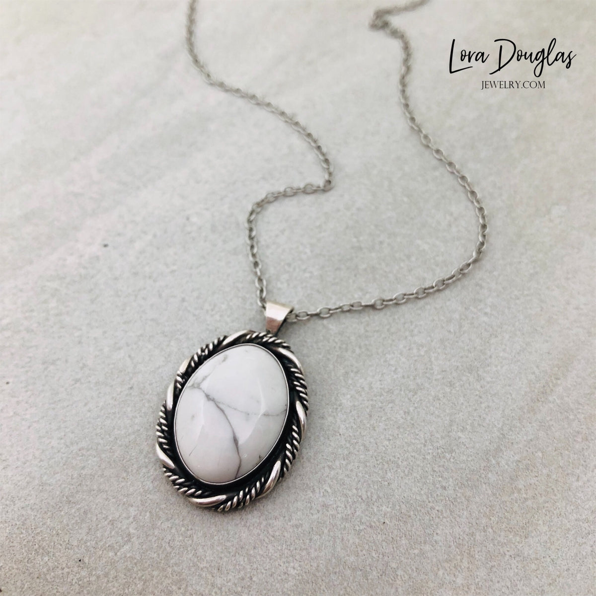 Artisan howlite necklace handcrafted from sterling silver with a natural white gemstone pendant measuring approximately 1 inch by 3/4 inch and an 18 inch sterling silver chain with antique patina.