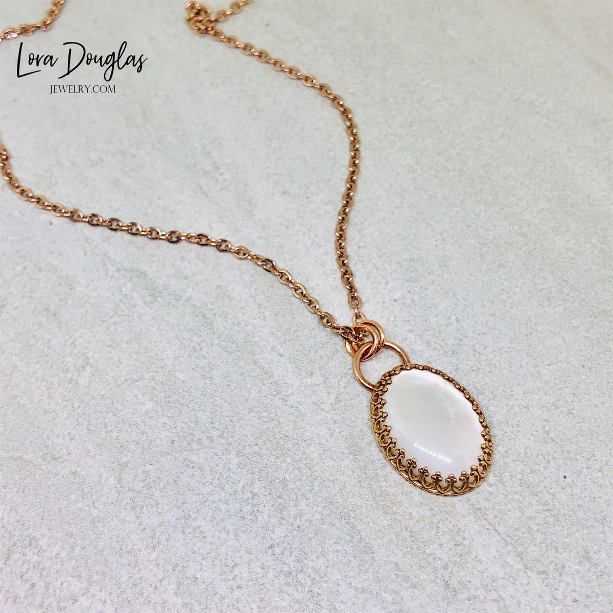 Bronze moonstone necklace with a natural gemstone pendant suspended from an 18 inch stainless steel chain. The combination of warm bronze and moonstone creates unique mixed metal jewelry for everyday styling.