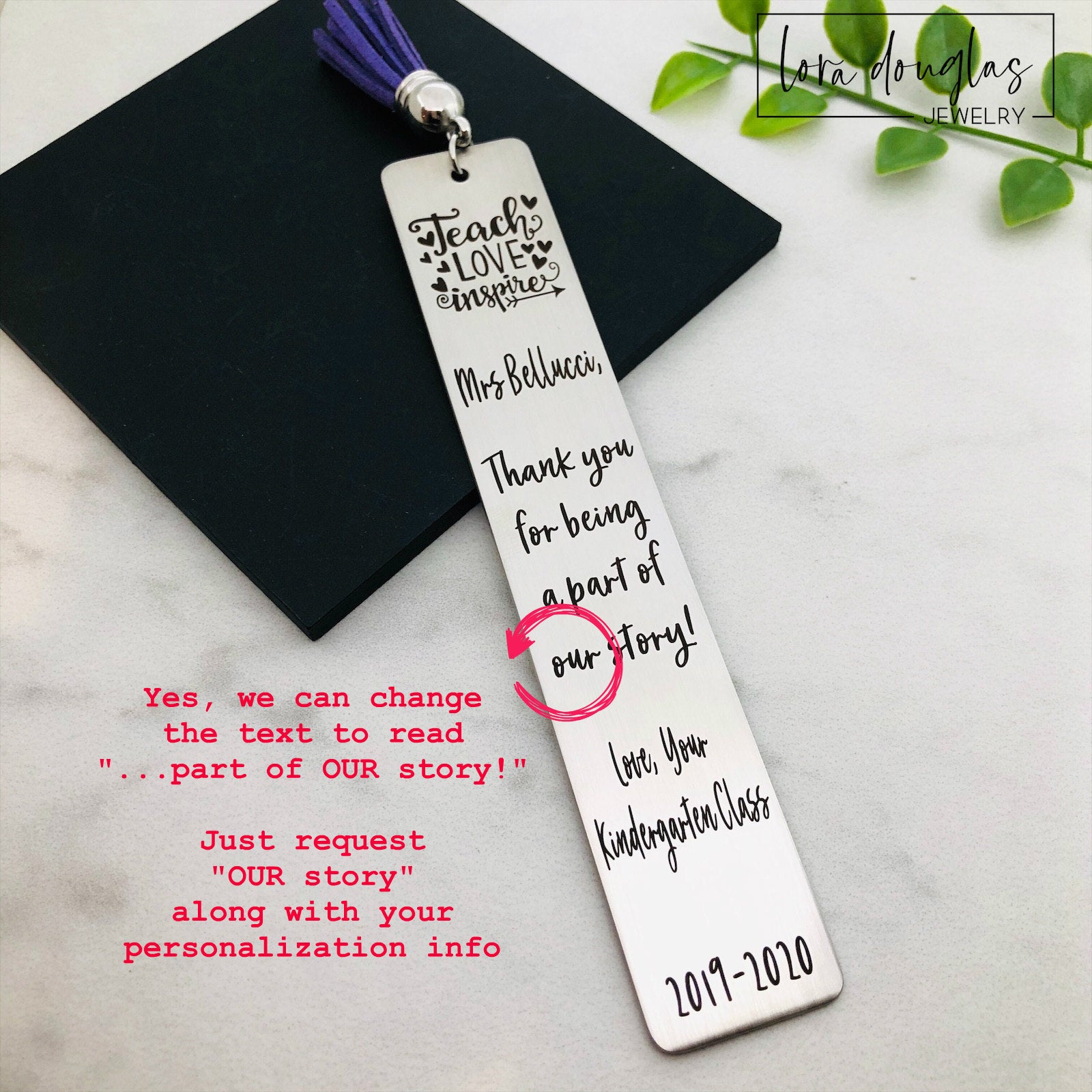 Close up of personalized teacher bookmark engraving with teacher name and message A stainless steel bookmarks with the phrases 'Teach Love Inspire' and 'Thank you for being my teacher' engraved on them, presented in a navy blue velvet pouch with tassels.