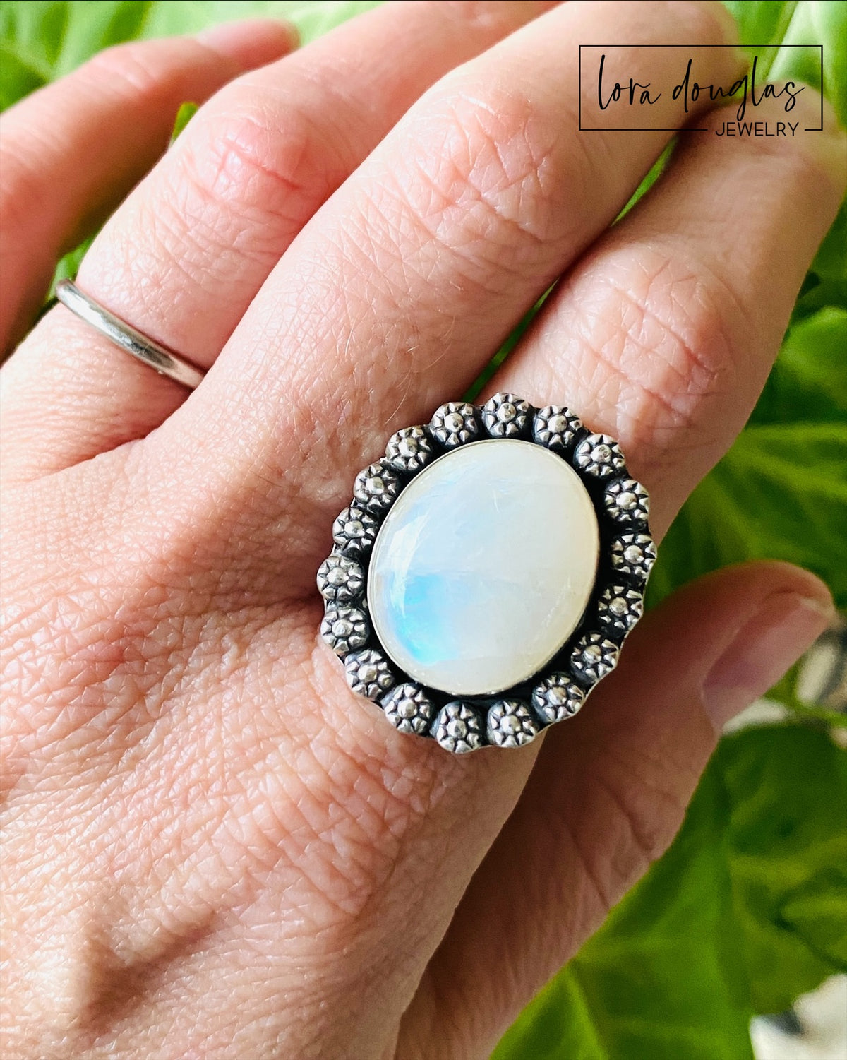 Close view of a large natural moonstone measuring approximately 17 x 20 mm in a handcrafted sterling silver ring. This size 9 gemstone statement ring showcases the stone as the bold focal point of the design.