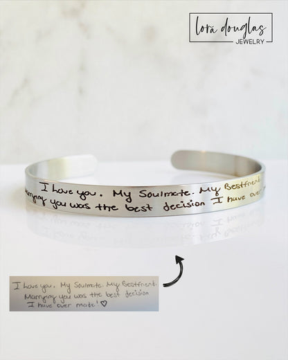 Custom engraved handwriting bracelet featuring a handwritten recipe, signature, wedding vows, or inspirational message. Stainless steel cuff available in silver, gold, and rose gold for anniversaries, graduations, and memorial gifts.