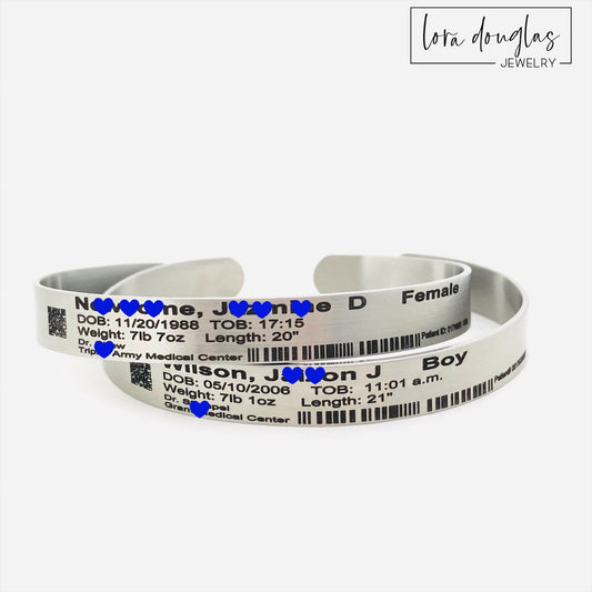 Custom newborn hospital bracelet keepsake featuring personalized birth information and decorative barcode details, permanently engraved on a stainless steel cuff as a lasting reminder of a baby's birth and hospital stay.
