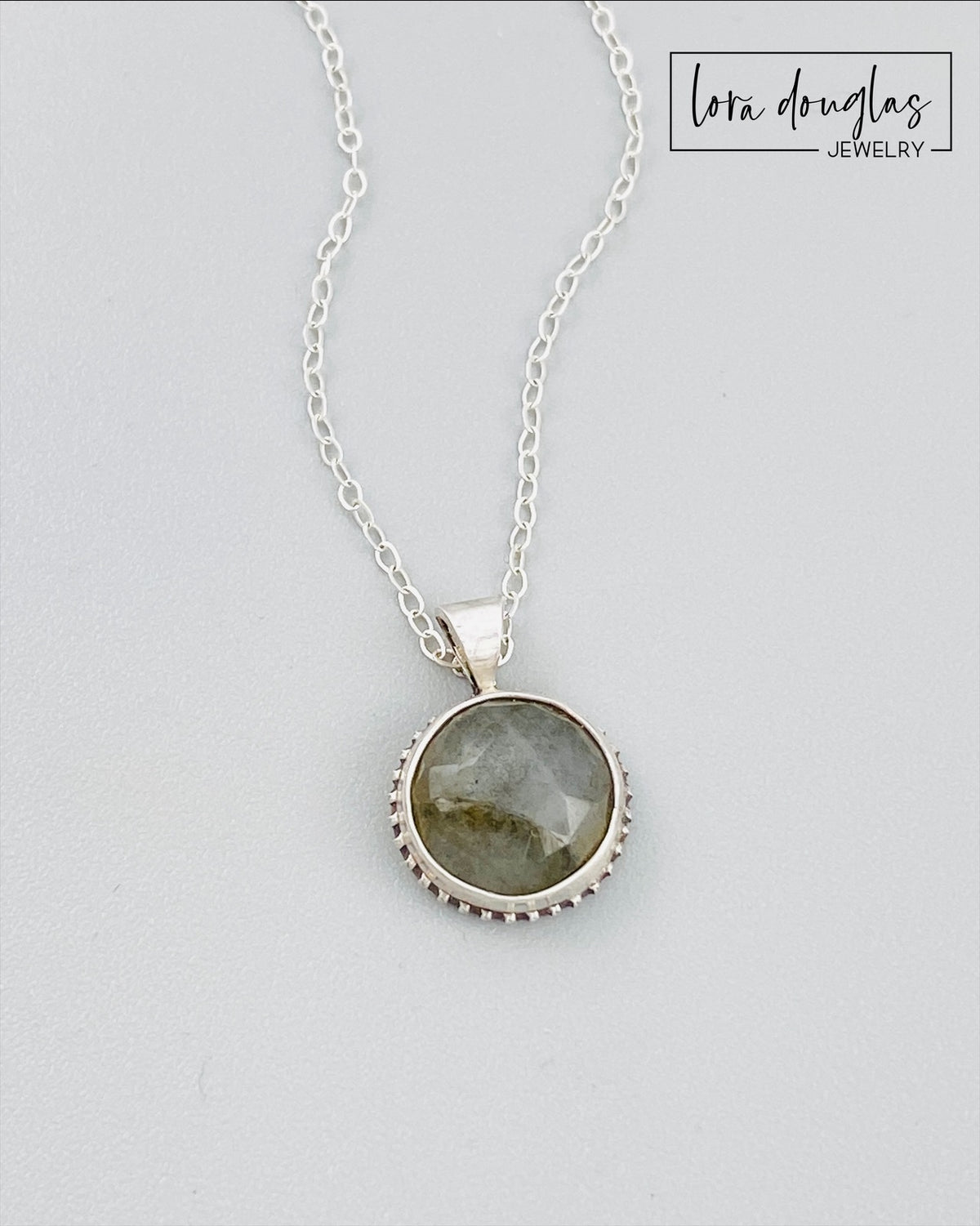 Dainty labradorite necklace handcrafted in sterling silver with a petite natural stone pendant. The 18 inch sterling silver chain creates a versatile gemstone necklace for layering, everyday wear, or gifting.