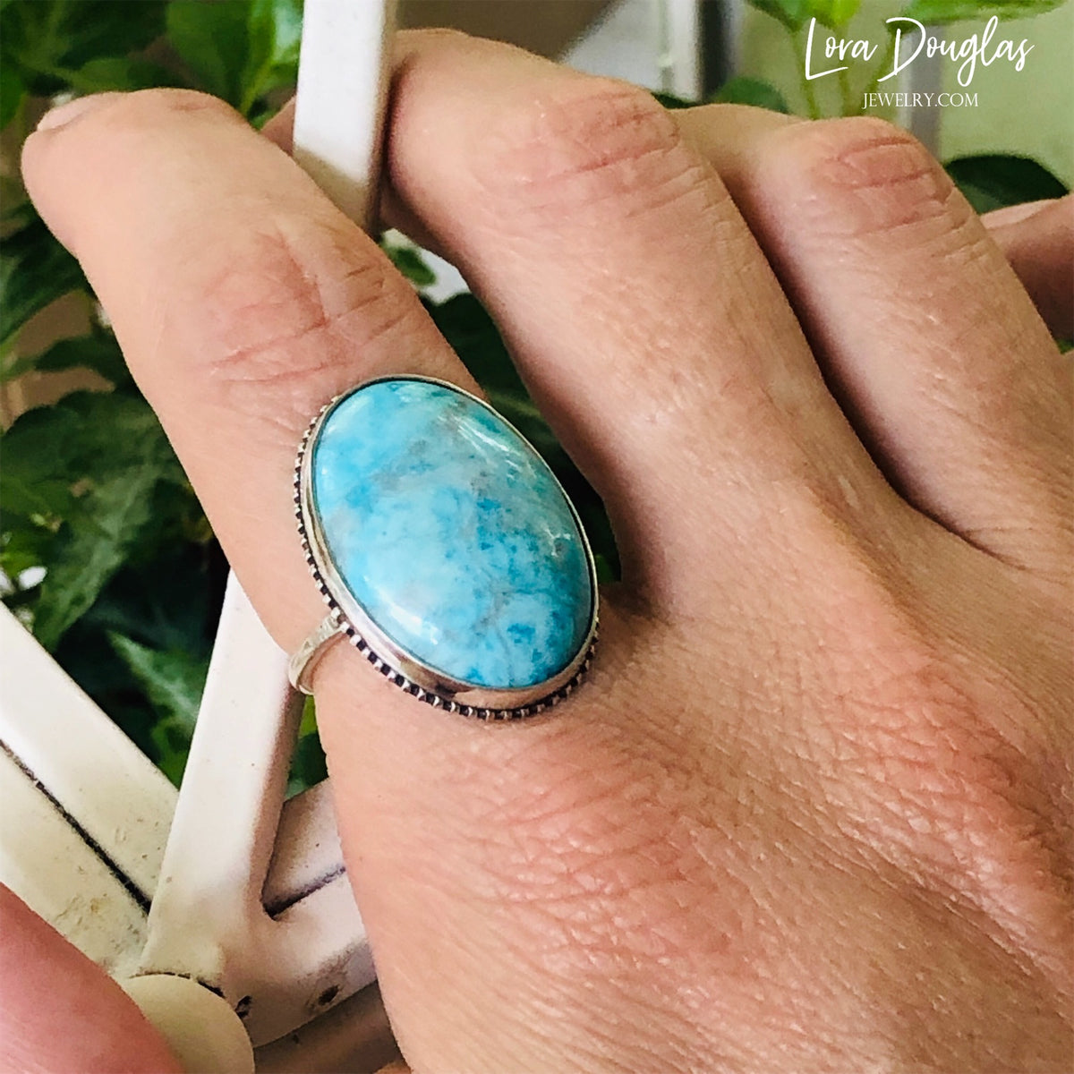 December birthstone ring featuring a natural turquoise gemstone in sterling silver, with a substantial 26mm x 19mm stone and finished size 7 band for a birthday, anniversary or meaningful jewelry gift.
