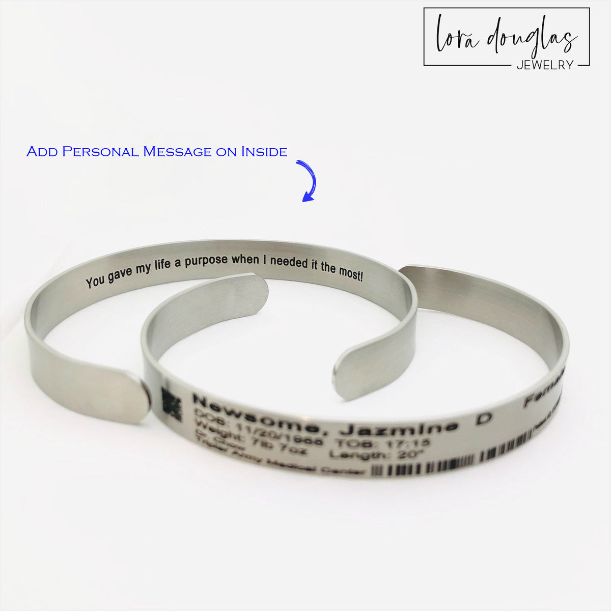 Engraved newborn hospital bracelet keepsake featuring custom baby birth information on a durable stainless steel cuff, designed for parents preserving meaningful details from their child's birth and first hospital stay.
