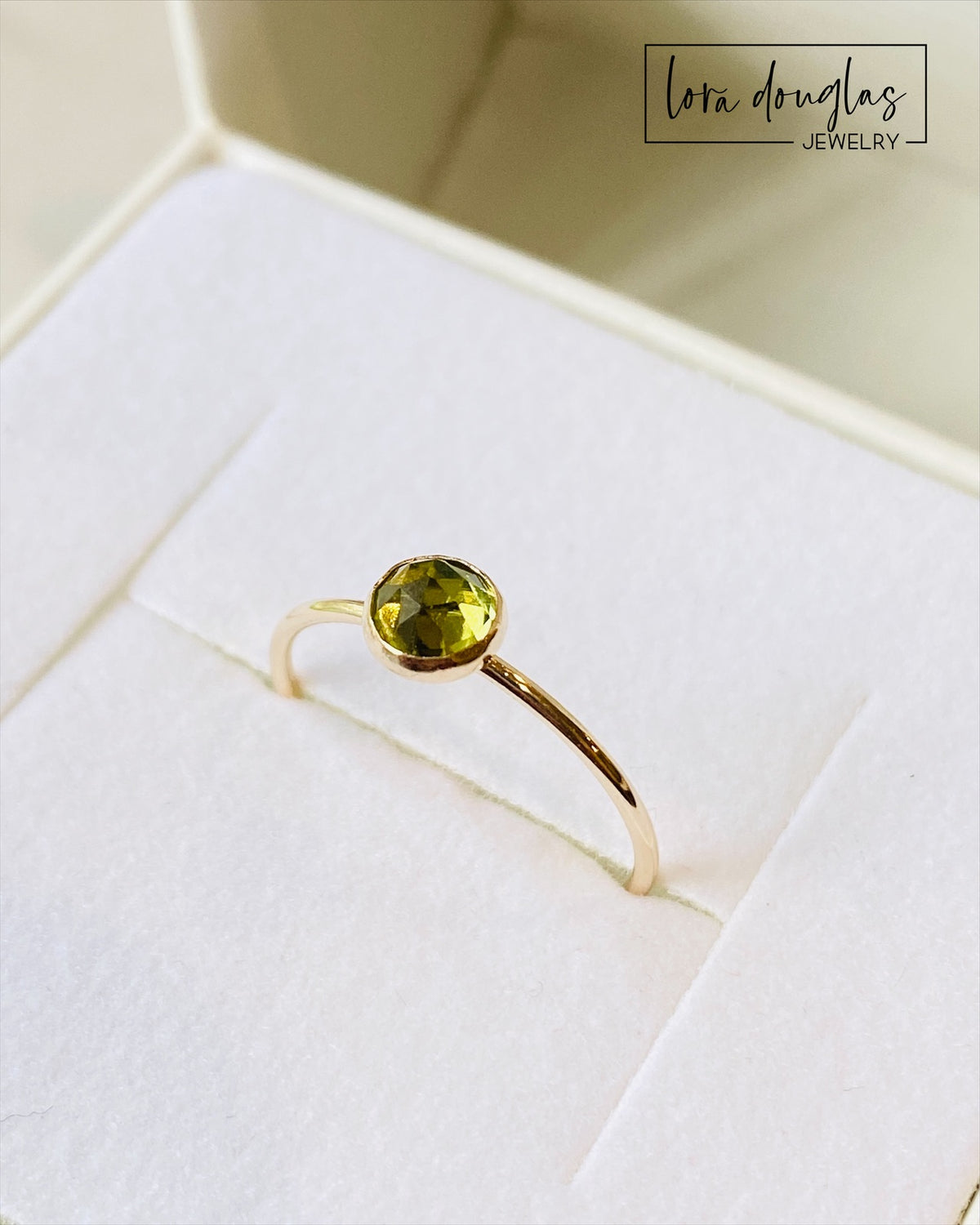 Gold filled peridot ring with a natural green 5mm rose cut gemstone, highlighting the faceted surface and minimalist solitaire design for shoppers looking for August birthstone jewelry.
