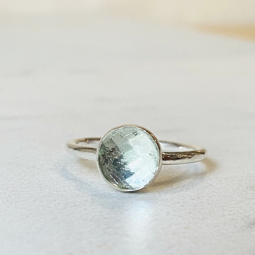 Green amethyst ring featuring an 8mm faceted rose cut prasiolite gemstone set in sterling silver, shown as a finished US size 6 solitaire ring for shoppers looking for distinctive green gemstone jewelry.
