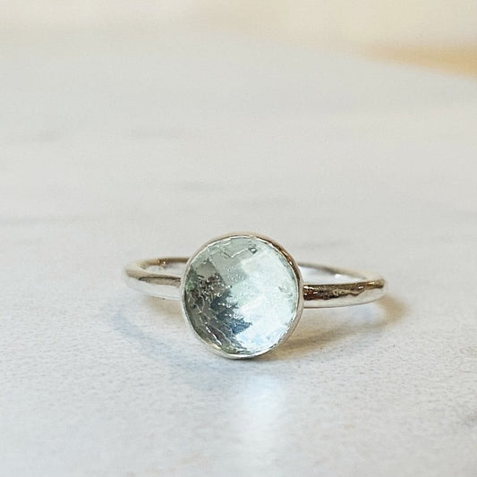 Green amethyst ring featuring an 8mm faceted rose cut prasiolite gemstone set in sterling silver, shown as a finished US size 6 solitaire ring for shoppers looking for distinctive green gemstone jewelry.

